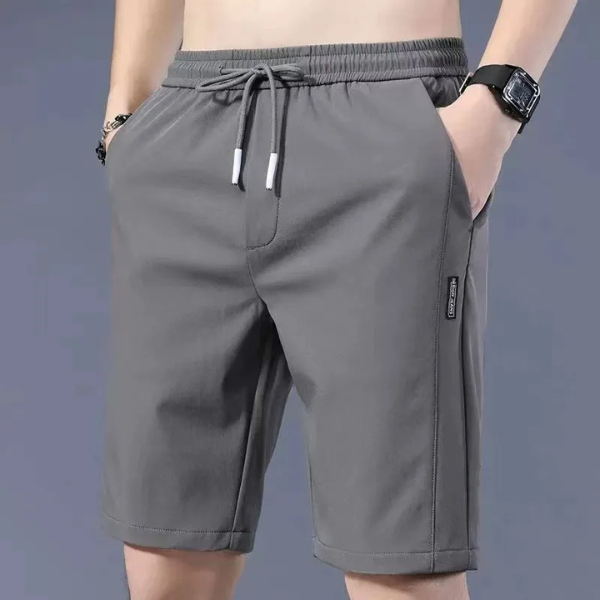 Grijze sportshorts voor heren met elastische tailleband en trekkoord, zijzakken, casual stijl, ideaal voor fitness en dagelijks gebruik.