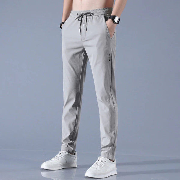 Grijze herenbroek, lente-zomer casual stijl, ademend en slank ontwerp, met elastische tailleband en trekkoord, geschikt voor sport en vrije tijd.