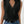 Zwarte mouwloze V-hals top voor dames, casual zomerstijl. Perfect voor modebewuste vrouwen, gecombineerd met blauwe jeans voor een trendy look.