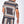 Man in marineblauw en goud barokprint tweedelig set, bestaande uit een overhemd en korte broek. Stijlvolle herenmode, zomeroutfit.