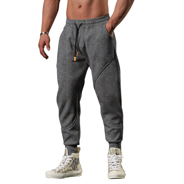 Grijze joggingbroek voor heren, sportief design, comfortabele pasvorm, elastische tailleband, casual streetwear, ideaal voor fitness en vrije tijd.