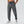 Grijze sportbroek voor heren, gemaakt van ademend materiaal met elastische tailleband en trekkoord. Perfect voor fitness en casual dragen.