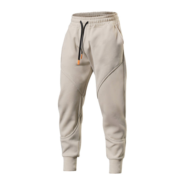 Beige joggingbroek met elastische tailleband, trekkoord en zakken. Comfortabele sportkleding voor heren. Perfect voor casual en sportieve looks.