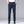 Man in donkerblauwe zakelijke broek, handen in zakken, witte blouse, zwarte schoenen. Stijlvolle herenkleding, formele outfit, modeaccessoires.