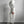 Persoon in witte joggingbroek en hoodie, casual sportkleding, comfortabele loungewear, mode voor thuis, minimalistisch design, grijze achtergrond.