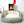 Groen hondenbed met beige binnenkant, geplaatst voor een houten kast met decoratieve items. Comfortabel en stijlvol huisdieraccessoire voor honden.