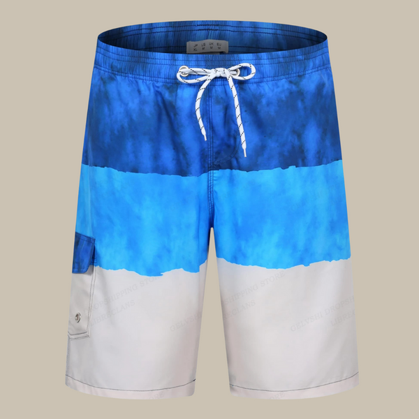 Blauwe en witte zwembroek met trekkoord, zijzak en kleurverloop. Perfect voor strandvakanties en zomerse activiteiten. Comfortabel en stijlvol ontwerp.