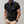 Heren poloshirt zwart met blauwe kraag en mouwdetails, borstzak, korte mouwen. Stijlvol en modern design, perfect voor casual en zakelijke gelegenheden.