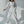 Vrouw in witte sportieve jumpsuit met capuchon en zwarte ritsen, modieuze streetwear, casual outfit, trendy dameskleding, minimalistisch design.