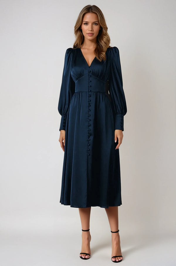 Donkerblauwe midi-jurk met lange mouwen en knoopsluiting, elegante damesmode, perfect voor formele gelegenheden, herfst- en wintercollectie.