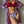 Vrouw in rode bikini met bloemenprint kimono, modieuze strandkleding, zomermode, elegante dameskleding, trendy badmode, stijlvolle outfit.