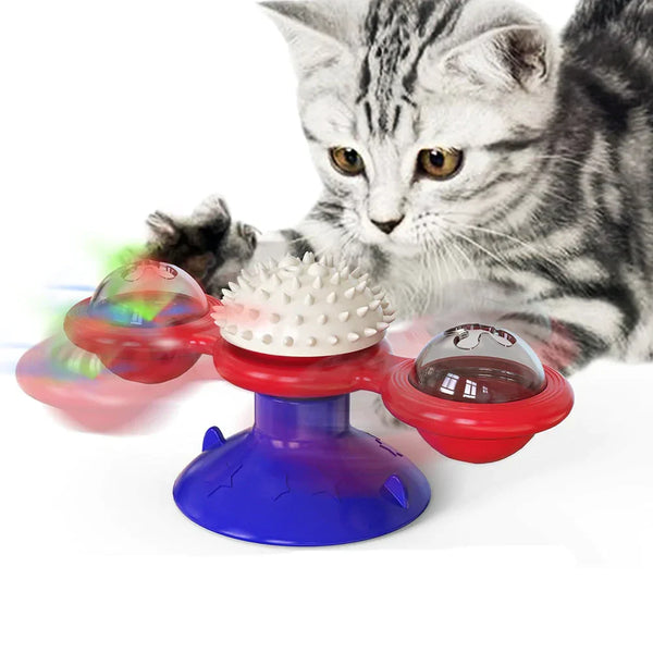 Grijze kat speelt met interactieve kattenspeelgoed spinner met LED-licht en zuignap, ideaal voor kattenvermaak en mentale stimulatie.