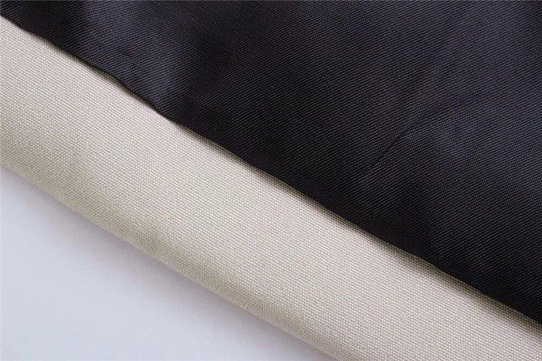 Zwart en beige textielstof, close-up. Hoogwaardige stoffen voor kleding en interieur, duurzaam en veelzijdig. Geschikt voor mode en decoratie.