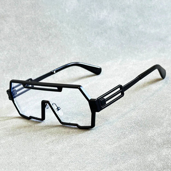 Zwarte futuristische bril met rechthoekige glazen en geometrisch montuur op grijze achtergrond. Trendy unisex accessoire, modern design.