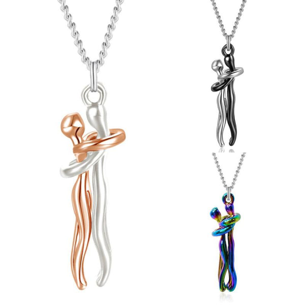 Twee omarmende figuren hanger ketting in zilver, roségoud en regenboogkleur. Moderne sieraden, liefdevolle omhelzing, minimalistisch design.