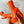 Oranje platformlaarzen met hoge hakken, trendy design, gedragen door een persoon. Perfect voor modieuze herfst- en winteroutfits.