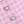 Roze tweed stof met twee sierlijke knopen, versierd met parels en strass, elegant en stijlvol ontwerp voor damesmode en kledingaccessoires.