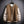 Bruine en beige varsity jas opgehangen aan een metalen raster, met knoopsluiting en contrasterende mouwen. Stijlvolle herenjassen, streetwear mode.