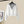 Witte cropped hoodie met grijze capuchon, hangend aan een hanger. Trendy dameskleding, casual streetwear, comfortabele mode.