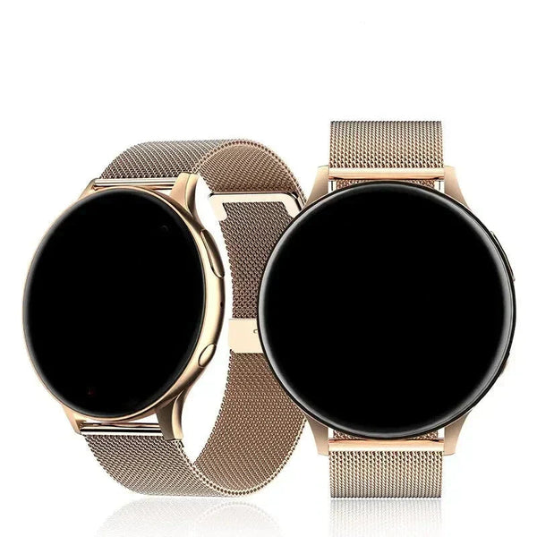 Twee gouden smartwatches met metalen mesh bandjes, minimalistisch ontwerp, ronde wijzerplaat, technologie-accessoire, stijlvol en modern.