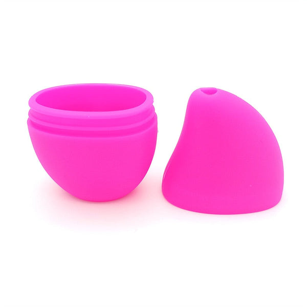 Roze siliconen eivormige opbergdoos, open en gesloten, ideaal voor het bewaren van kleine voorwerpen. Handig, duurzaam en stijlvol ontwerp.
