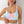 Vrouw draagt kleurrijke tie-dye sportbeha, pastelkleurig, comfortabele fitnesskleding, trendy activewear voor dames, sportmode.