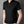 Zwarte polo met halve rits voor heren, korte mouwen, casual stijl. Ideaal voor zomermode en alledaagse outfits. Comfortabel en stijlvol design.