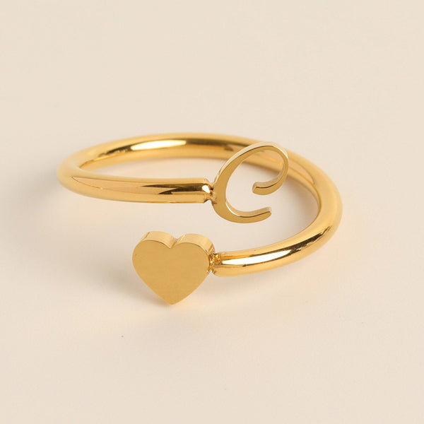 Gouden open ring met hart en krulontwerp, minimalistisch sieraad, elegante damesring, modieuze accessoire, perfect cadeau voor vrouwen.