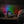 Ronde digitale wekker met LED-kleurenprojectie op nachtkastje, houten achtergrond, tijd 23:00. Moderne slaapkameraccessoire, sfeerverlichting.