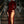 Vrouw in elegante, rode fluwelen avondjurk met hoge split, poseert op trap. Luxe mode, avondkleding, glamour, stijlvolle outfit.