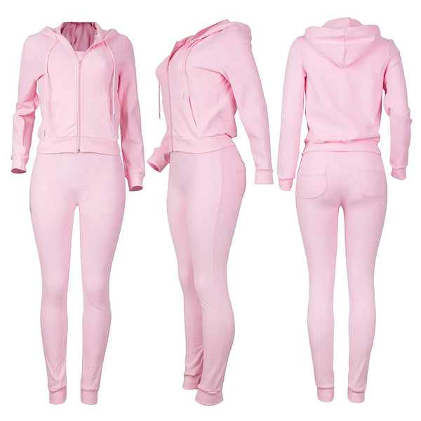 Roze dames trainingspak met capuchon, bestaande uit een hoodie en legging. Comfortabel sportkleding set, ideaal voor fitness en casual wear.