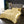 Luxe gouden satijnen dekbedovertrek set op een kingsize bed met kussens, moderne slaapkamerinrichting, elegante uitstraling, glanzende stof.