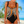 Vrouw in kleurrijk badpak met geometrisch patroon op tropisch strand, zomermode, strandkleding, vakantie, zwemkleding, damesmode.