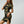 Vrouw in zwarte cheongsam met gouden drakenprint, korte mouwen en hoge kraag. Elegante Chinese jurk, moderne mode, traditionele stijl.