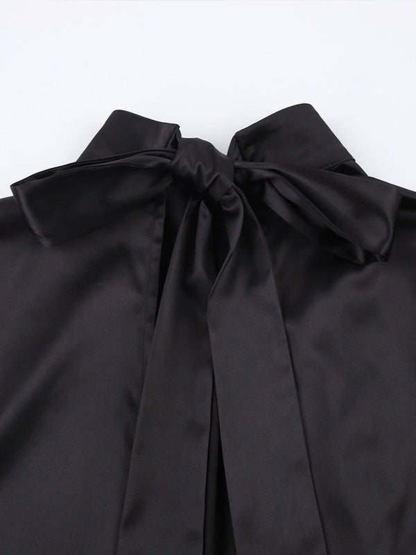 Zwarte satijnen blouse met strikdetail, elegante damesmode, luxe uitstraling, perfect voor formele gelegenheden en stijlvolle outfits.