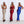 Drie satijnen jurken in goud, rood en blauw, gedragen door modellen. Elegante avondjurken, perfect voor feestelijke gelegenheden.