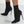 Zwarte soklaarzen met hoge naaldhakken, elegante damesmode, trendy enkellaarzen, stijlvol ontwerp, perfect voor herfst- en winteroutfits.