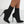 Zwarte soklaarzen met hoge naaldhakken, elegante damesmode, trendy enkellaarzen, perfect voor avondkleding en stijlvolle outfits.