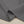 Grijze katoenen stof close-up, met zichtbare stiksels en textuur, ideaal voor naaiprojecten, kleding en interieurdecoratie.