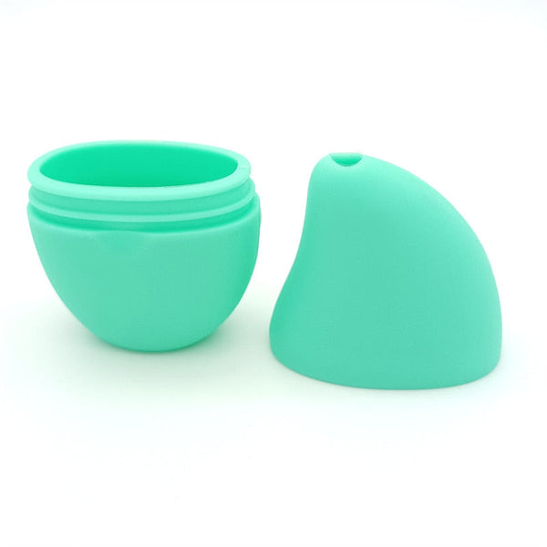 Mintgroene siliconen opbergdoos met deksel, ideaal voor cosmetica of sieraden. Compact en duurzaam ontwerp, perfect voor reizen en dagelijks gebruik.