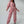 Vrouw in roze fleece jumpsuit met capuchon, elastische taille en sneakers. Modieuze dameskleding, comfortabele loungewear, trendy outfit.