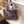 Grijze pluchen handtas op witte tafel bij raam, modieus en zacht, perfect voor winterse outfits. Luxe accessoire, trendy damesmode.