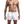 Man in witte zwembroek, gespierd bovenlichaam, tatoeages op armen. Zwembroek met trekkoord, strandmode, heren zwemkleding, zomerstijl.