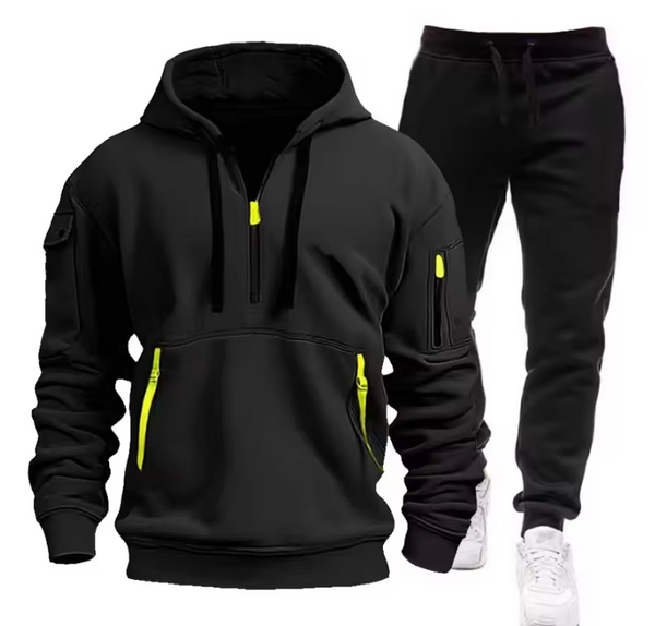 Zwarte hoodie en joggingbroek set met gele ritsen, sportieve herenkleding, comfortabele trainingspak, casual streetwear outfit.