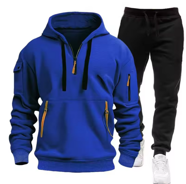 Blauwe hoodie met ritsen en zwarte joggingbroek, sportieve herenkleding, comfortabele casual outfit, ideaal voor dagelijks gebruik en sportactiviteiten.