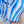 Blauw-wit gestreepte bikini op beige achtergrond, zomermode, strandkleding, damesbadmode, trendy zwemkleding, gestreept patroon.