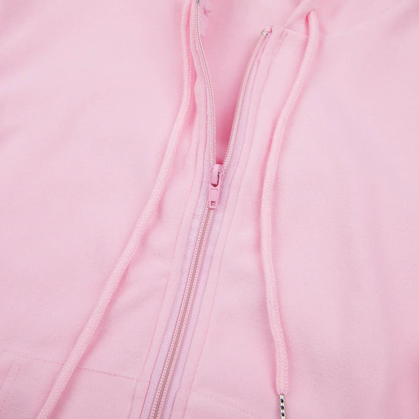 Roze hoodie met rits en trekkoorden, close-up. Comfortabele katoenen stof, casual mode, unisex kleding, trendy streetwear.