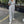 Grijze damesjumpsuit met capuchon, lange mouwen en zakken, casual streetwear, comfortabele pasvorm, ideaal voor dagelijks gebruik en sportieve stijl.