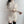 Vrouw in crèmekleurige geribbelde coltrui-jurk, lange mouwen, modieuze herfstkleding, minimalistisch design, trendy damesmode.