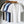 Zes katoenen T-shirts in verschillende kleuren, waaronder wit, blauw en zwart, hangen op houten hangers. Casual herenkleding, modetrends.
